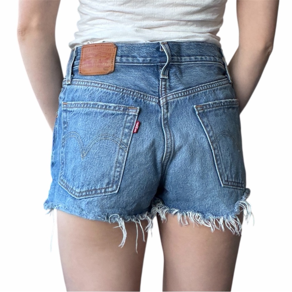 Levi’s 501 mid wash denim cut off high waisted shorts